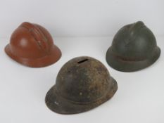 Three French Adrian Helmets, with missing crests, 1 with missing helmet ridge.