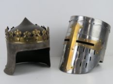 Two reenactor or display pieces; a Medieval knight helmet and a King Richard the Lion heart helmet.