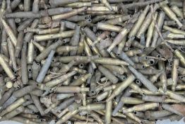 A box of inert spent 5.56 blank shell cases.