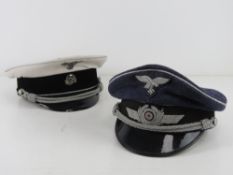 Two reproduction WWII German Officers Caps.