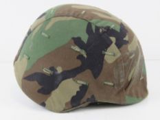 A US M3 Helmet with cover, liner and chin strap.