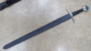A reenactor Medieval style sword 'Excaliber King Arthur', measuring 41 inches in length.