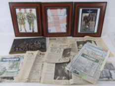 A quantity of military items including; WWII newspapers and campaign maps,