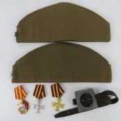 A Russian Marching compass together with three medals and two side caps.