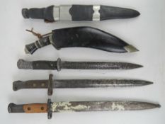 A scottish skean dhu (Sgian Dubh). Together with three bayonets and a Kukri Gurka knife. Five items.