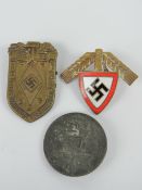 Three WWII German day badges.