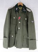 A reproduction WWII German SS Battle Tunic size XL.