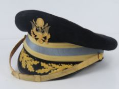 A WWII US Admirals peaked cap bearing label for Berkshire De-luxe, with badge to front.