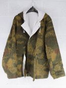 A repro WWII German Winter Parka in splinter camouflage. Size XL.