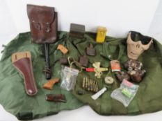 Assorted militaria including kit bags, pouches, oil bottles, holster, truncheon.
