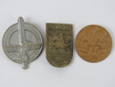 Three WWII German day badges.