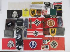 A quantity of assorted German items, armbands, wallets, cloth badges, tie, shoulder boards.