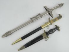 Three reproduction WWII German dress daggers with scabbards.