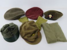 Six assorted contemporary caps and berets.