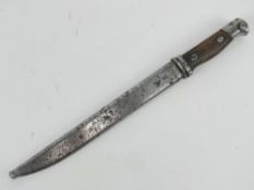 A Japanese bayonet having wooden grip, with scabbard, blade measuring 24cm in length.