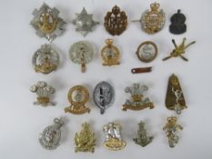 An assorted British regiment cap/helmet badges, approx 20 items, inc The Royal Scots, RAF,