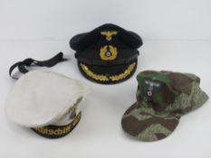 A reproduction German WWII Kreigsmarine cap (size 59) together with a reproduction German WWII