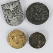 Four reproduction WWII German badges.