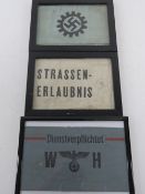 Three armbands in frames.