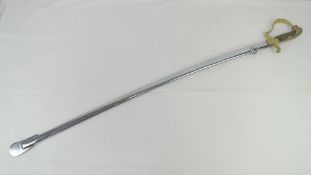 A reenactor Prussian Cavalry sword having lion head pommel, with scabbard.