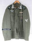 A reproduction WWII German Battle Tunic size XL.