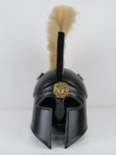 A reenactor or display piece Spartan helmet with natural coloured plume over.