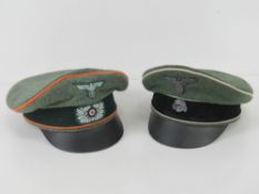 Two reproduction German peaked caps being SS Officer's cap (size 60) and Feldgendarmie Officer's