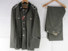A reproduction WWII German SS Battle Tunic and trousers size XXXL.