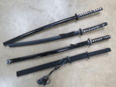 Three decorative Katana with scabbards, measuring 41, 42 and , 44 inches respectively.