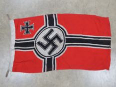 A reproduction WWII German flag with ink stamps size 31 x 17 ¼ inches.