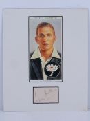 Autograph; a hand signed slip signed by the cricketer Len Hutton,
