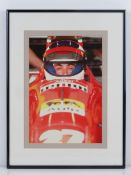 A photographic print of Jean Alesi Ferrari F1 Driver in his racing car, framed and mounted,
