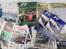 A quantity of race programmes, passes, marshal bibs etc.