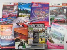 A quantity of race programmes, passes, marshal bibs etc.