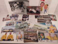Two hand signed photographic postcards of Sir Sterling Moss,