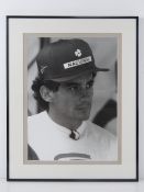 A photographic print of Ayrton Senna (1960-1994) World Champion 1988, 1989 and 1991,