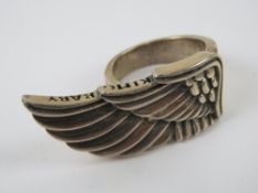 A ring in the form of an open wing, stam