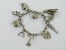 A silver charm bracelet having eleven ch