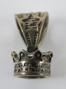 A pendant in the form of a crown, stampe