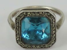 A silver, marcasite and blue stone cockt
