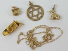 A 9ct gold Star of David pendant, hallmarked 375. Together with a 14ct gold boat charm (0.