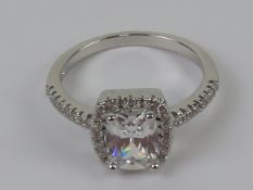 A silver cocktail ring set with white stones and stamped 925, size N-O.