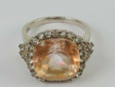 A silver and citrine cocktail ring, large central square cut peach coloured citrine, 14mm sq,