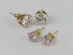 Two pairs of stud earrings each having 9ct gold butterfly backs, no apparent hallmarks.