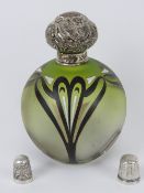 Two HM silver thimbles together with a glass perfume bottle having HM silver top. Three items.