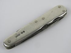An HM silver multi-tool pocket knife, hallmarked for Sheffield.