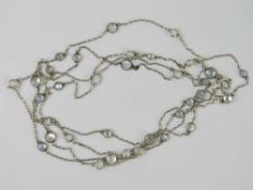 A vintage white metal necklace set with moonstone cabachons (one stone deficient possibly having