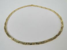 A 14ct gold Greek Key pattern necklace, 43.5cm in length, tongue clasp, stamped 585, 20.