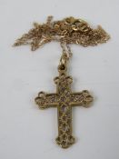 A filigree crucifix on 9ct gold chain necklace, cross measuring 2.7cm inc bale. In presentation box.