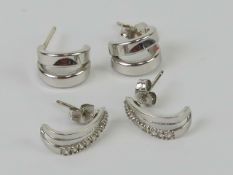 A pair of 18ct white gold half hoop earrings, hallmarked 750,